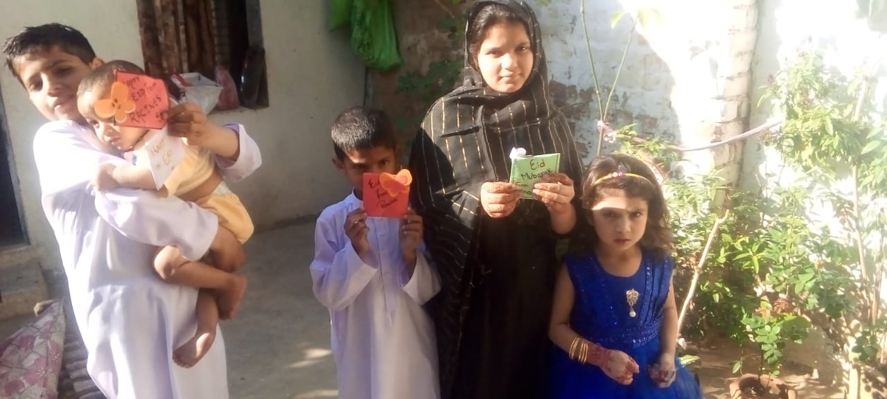 Children lined up outdoors awaiting distribution